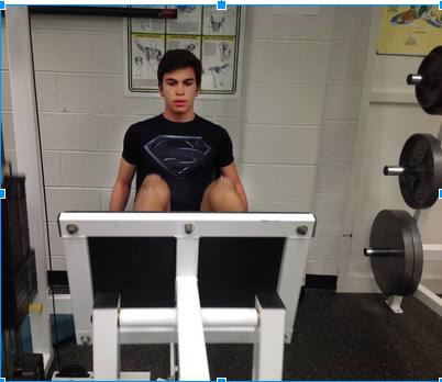 Timothy Breuer exercises in the WIS weight room on December 15th. 
Photo Credit: Andrew Richardson