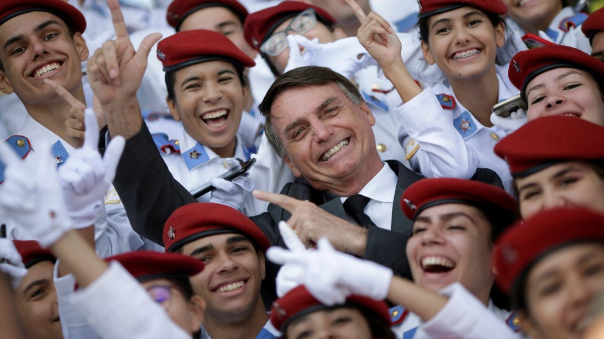 Federal+deputy+Jair+Bolsonaro%2C+a+pre-candidate+for+Brazils+presidential+elections%2C+takes+pictures+with+students+of+the+military+college+during+an+Army+Day+ceremony%2C+in+Brasilia%2C+Brazil+April+19%2C+2018.+REUTERS%2FUeslei+Marcelino