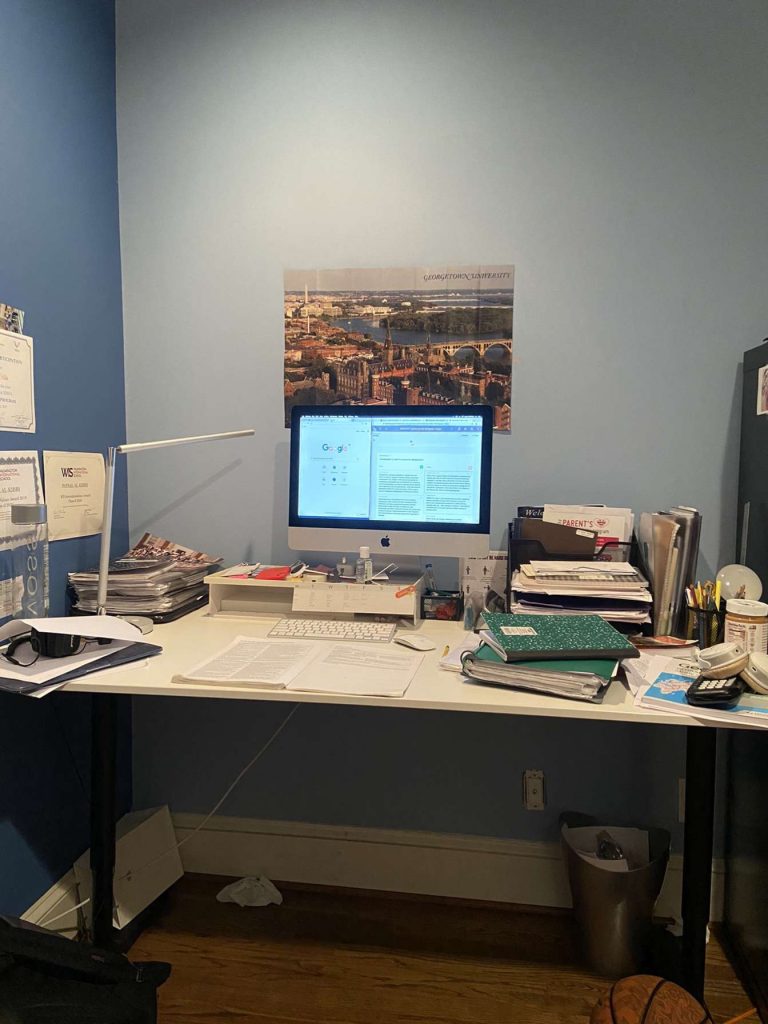 12th Grade, Faysal Al-Kibbi:
“Georgetown poster in my line of sight for some extra motivation. Wide desk to put all my papers and stuff on. Desktop in the middle so everything can be but around its centerpiece".
