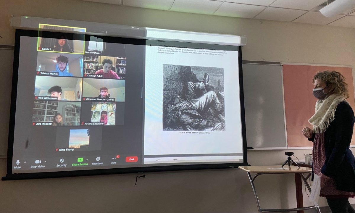 Nora Brennan teaching a 10th-grade History class in hybrid learning, with half of the class on Zoom. Brennan recently returned from several months of family leave and is adjusting her teaching style for this new form of learning. (Maia Nehme/International Dateline)