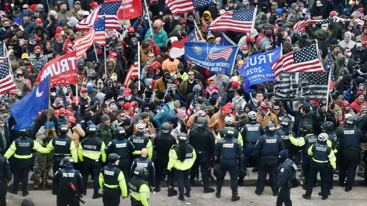 Trump supporters clash with police and security forces as they storm the US Capitol in Washington, DC on January 6, 2021. - Donald Trumps supporters stormed a session of Congress held today, January 6, to certify Joe Bidens election win, triggering unprecedented chaos and violence at the heart of American democracy and accusations the president was attempting a coup. (Photo by Olivier DOULIERY / AFP) (Photo by OLIVIER DOULIERY/AFP via Getty Images)