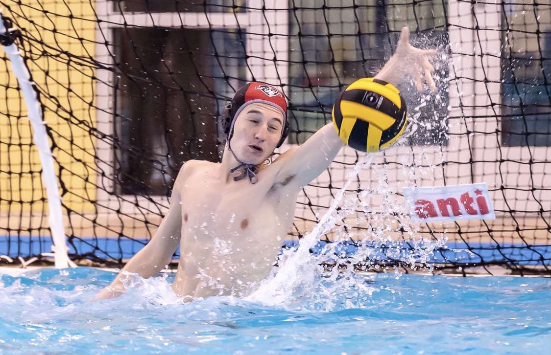 Liam Byrne 21 saving a shot during a recent water polo match.