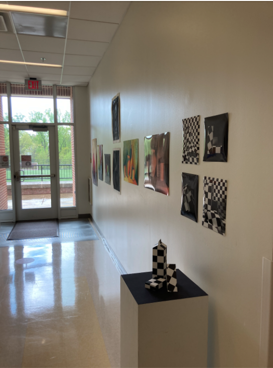 IB Art students exhibited their artwork in the hallways of the AAA Building. Unlike seniors last year, they got to have an in person showcase with the community. (Naomi Breuer/International Dateline)