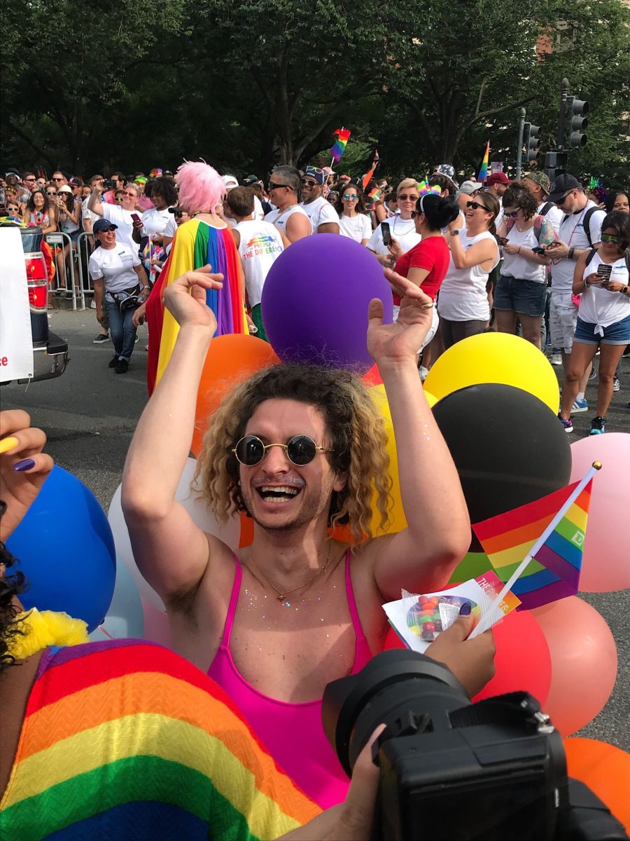 A+person+smiles+at+the+2019+DC+Pride+Parade.+%28Courtesy+of+Clara+Mello%29