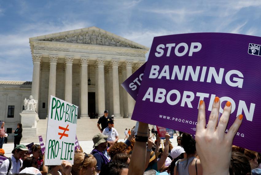 Pro-choice protestors picket the Supreme Court. A recent Texas law restricting most abortions engenders fury. (Eddie Gaspar/The Texas Tribune)