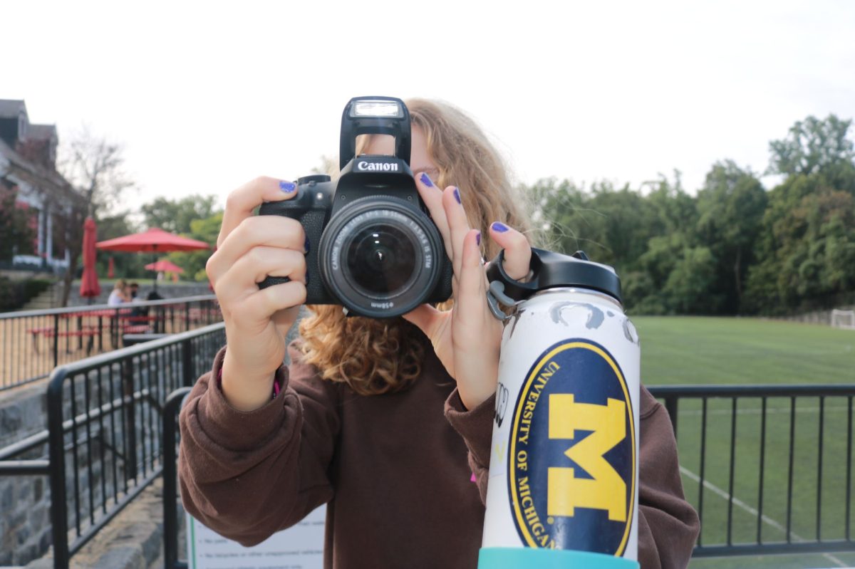 Sophomore Klara Young holding a camera used for filming her groups film project in the Narrative Film class. (Courtesy of Martina Tognato-Guaqueta).