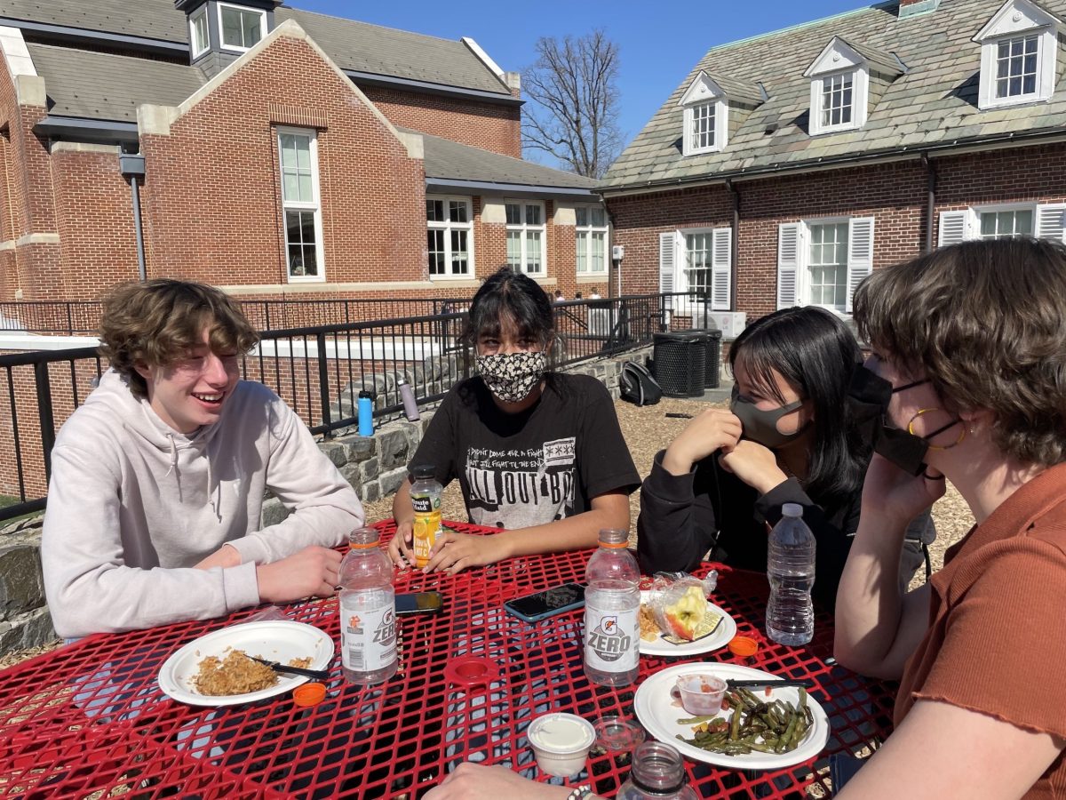 WIS students eating lunch, respecting each others choices on weather to mask or not to mask. (William Crawford, Ava Gonzalez, Lila Lefevre-Iwata and Jenna Loescher-Clark) 
Courtesy of Andrea Brudniak 