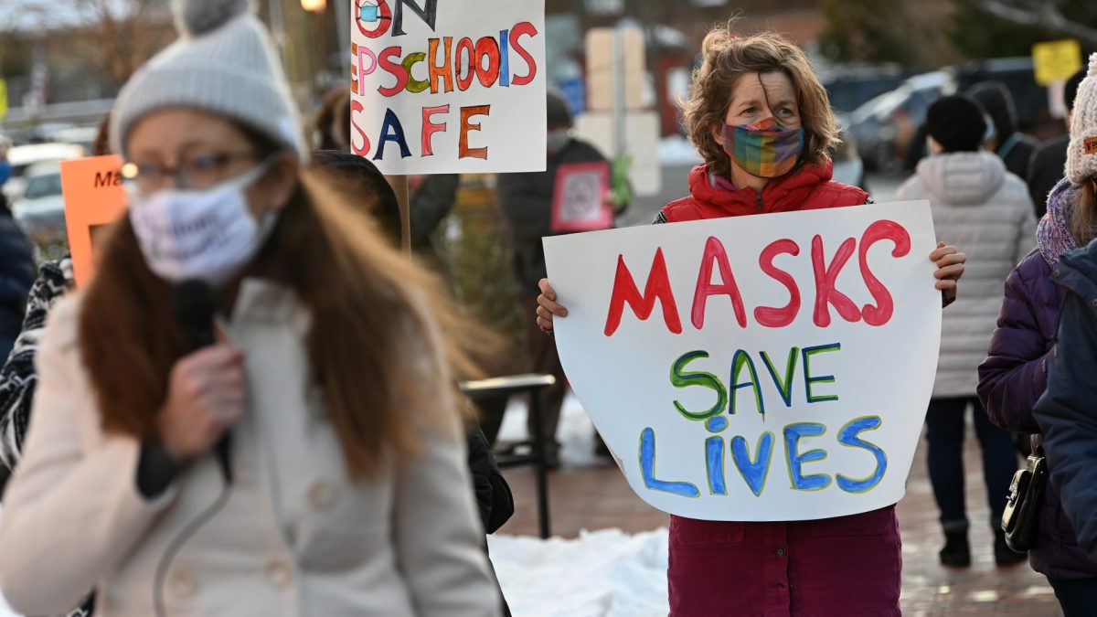 Virginia parents protest Governor Glenn Youngkins executive order to make mask wearing optional in schools. Seniors Claire Ducharme and Andrea Villafuerte, who attend schools in Virginia, note the impact of this bill on their school communities. (Matt McClain/The Washington Post)