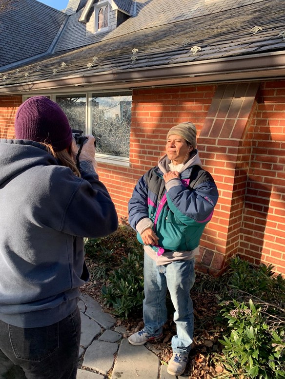 Andrea Brudniak-Berrocal (left) taking a picture of Jose Martinez (right) for her photo project. Martinez was one of seven other subjects. (Derin Kirtman/International Dateline)