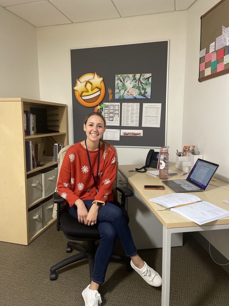 Sara Sonsalla, the new Upper School counselor, sits at the desk in her office on the second floor of the AAA building. (Luca Cruz/International Dateline)