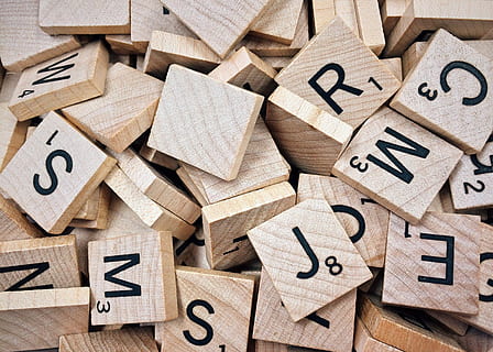 Scrabble tiles scattered on a table. (Pixabay)