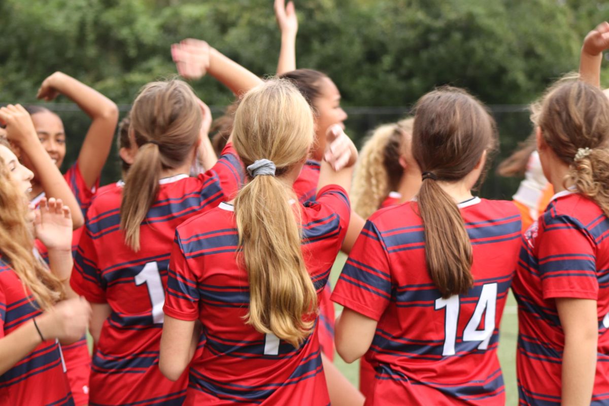 The Girls Varsity Soccer Team huddling before a game. (Courtesy of Samantha Brown)
