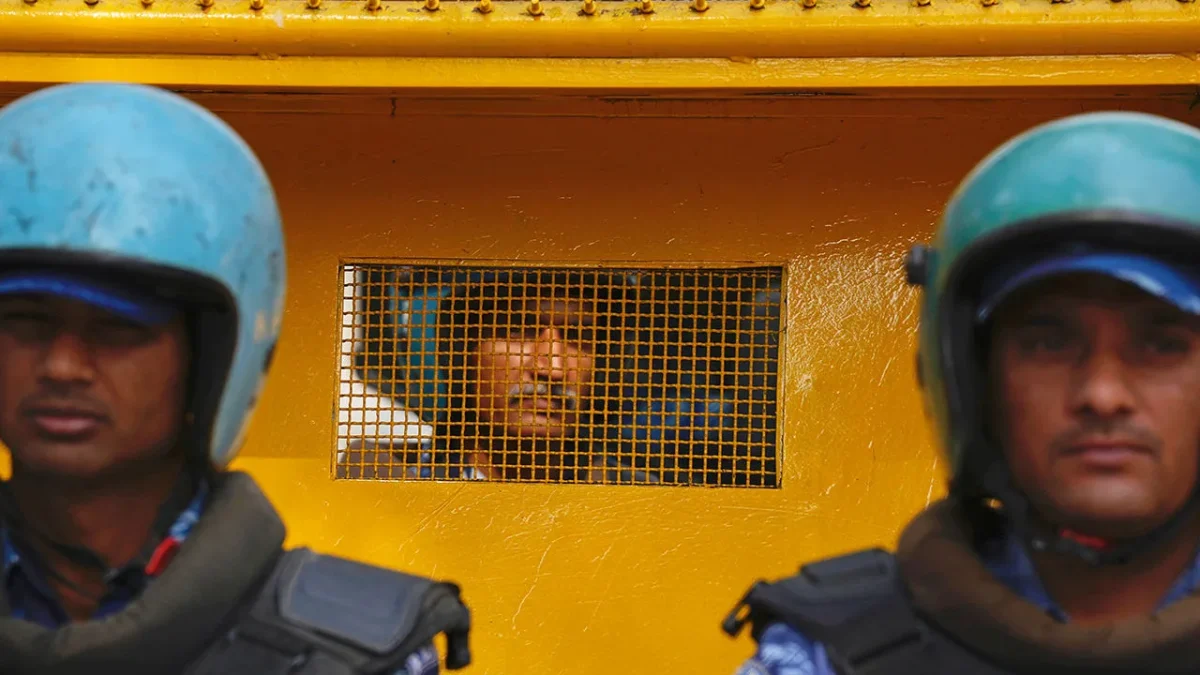 Arvind Kejarawal, Chief Minister of Delhi, in a police van after his arrest. Kejarawal is the first sitting Chief Minister in India’s history to be arrested. (Courtesy of AP)