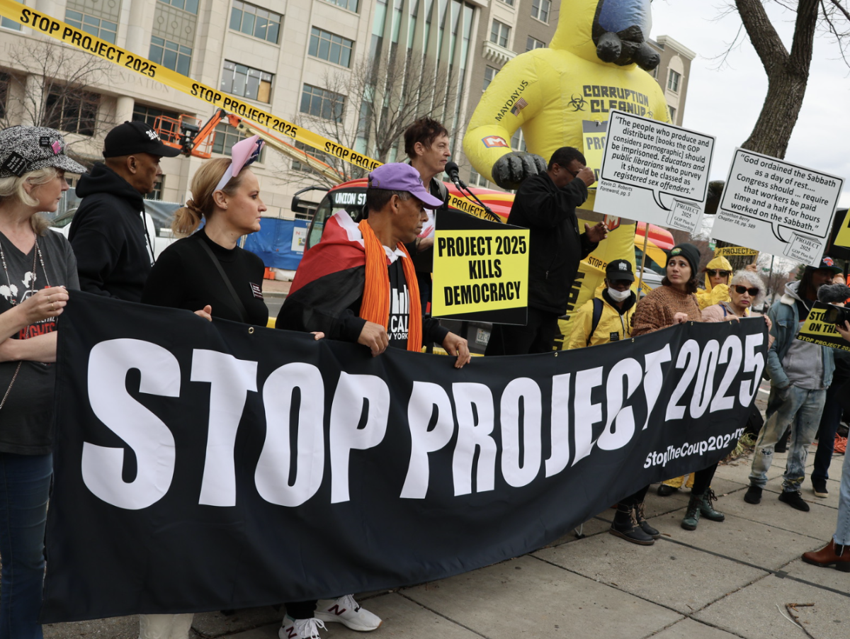 "Stop Project 2025" banner at a protest outside the Heritage Foundation. This policy proposal is receiving increased attention during the 2024 election. (Elvert Barnes/Flickr)