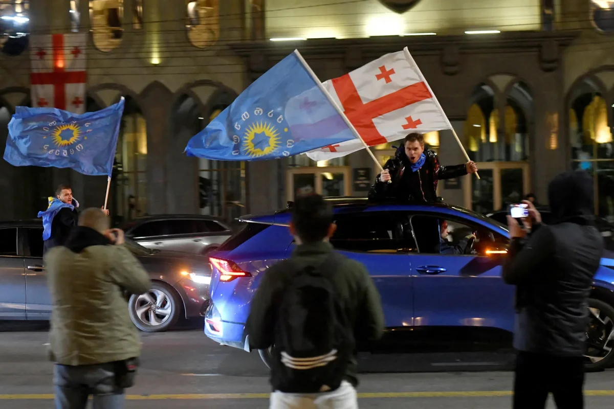 Supporters of the Georgian Dream party drive through Tbilisi in celebration after election results were announced. Courtesy of Reuters 